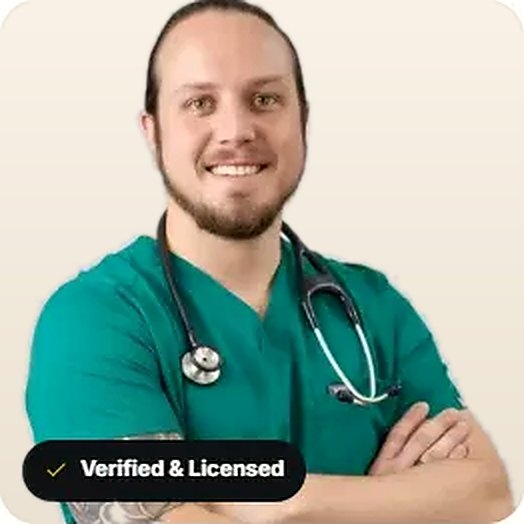 Dr. Johnathan Chance Miller, a licensed physician, in teal scrubs with a stethoscope